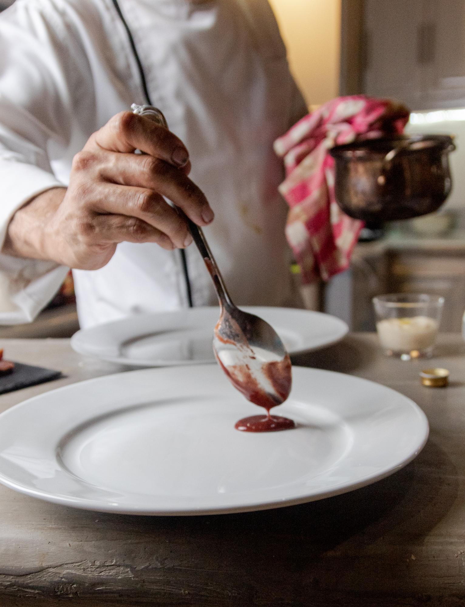 Chef arranging a rustic plated dish